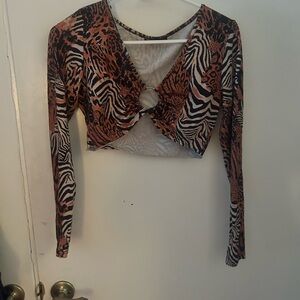 Small top. Barely worn. Mixed animal print.